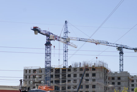 Construction cranes for the construction of a new residential building