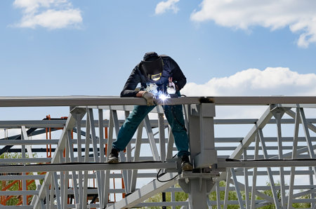 man welds at the factory