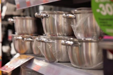 Stainless steel pots and pans for sale in the market.の写真素材