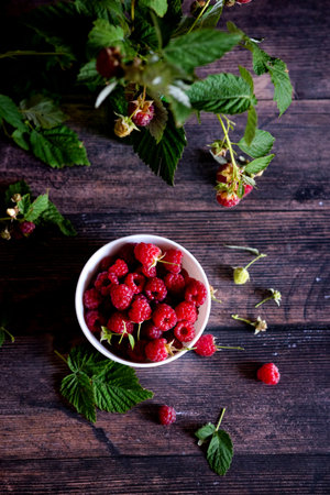 Fresh raspberries in bowl. Ripe juicy fresh raspberries. Organic raspberries, healthy food,...