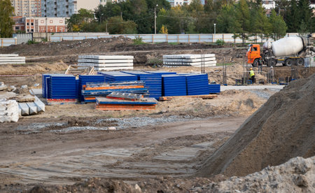 Concreting work at the construction site. Construction workers pour liquid concrete from cement...