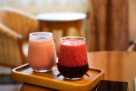Berry smoothie. On wooden table with ingredients, from above.