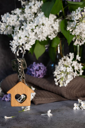 Real estate agent handing over house keys in hand