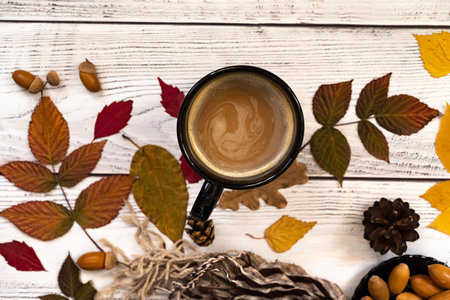Festive autumn decor from pumpkins, berries and leaves on a white wooden background. Concept of Thanksgiving day or Halloween. Flat lay autumn composition with copy space.の写真素材