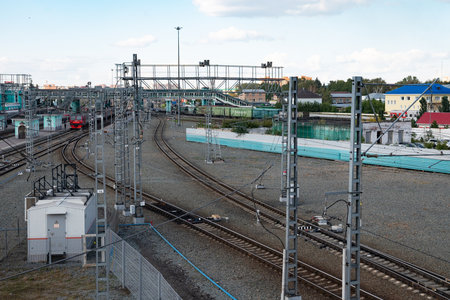Railway tracks and trains on them. Rails in perspective.