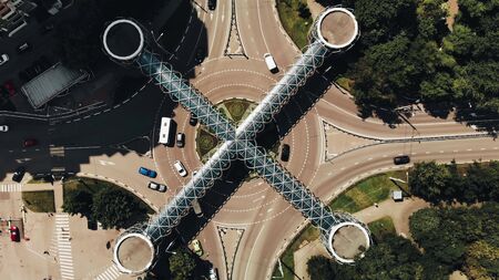 Aerial view of traffic. Time lapse of busy traffic on roundabout with nice architecture pedestrian...