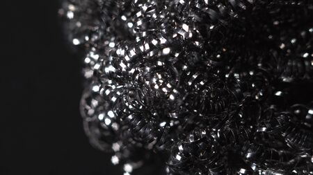 Beautiful macro shot footage close-up of a metal sponge for washing dishes. It can be a great...