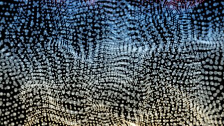 Colorful background of flowing fabric. Smooth and soft.の写真素材