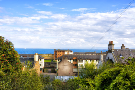 View over the roofs and the sea in the Scottish town of Kirkcaldyの写真素材