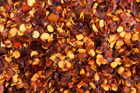 Chilli pepper flakes background. View from above