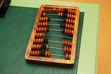 An old abacus on the green table