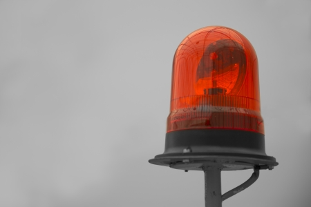 Shaded red beacon on yellow rod warning seekersの写真素材