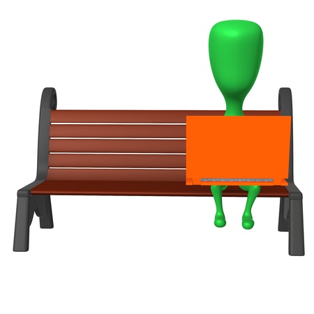 Front view puppet work after laptop on benchの写真素材