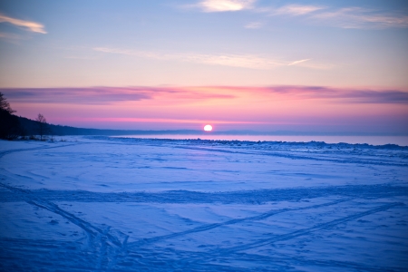 sunset on the beach at nightの写真素材