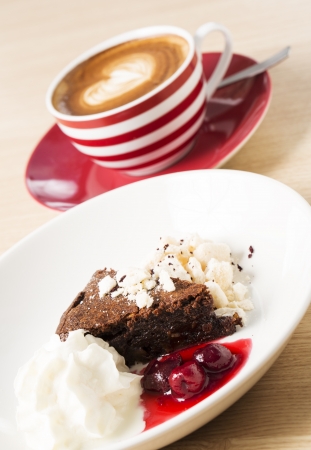 Cup of cappuccino with half eaten light dessertの写真素材