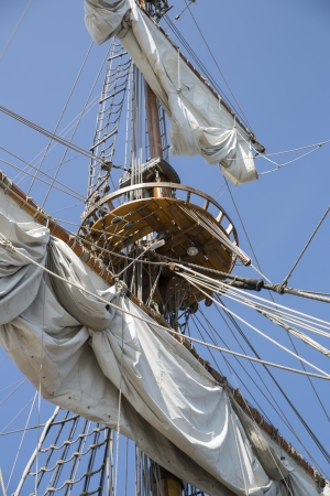 High mast with collected sails at windy dayの写真素材