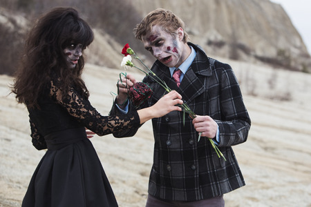 Zombie giving flowers to his evil dateの写真素材