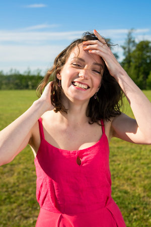 Young female smiles flirty to a camera