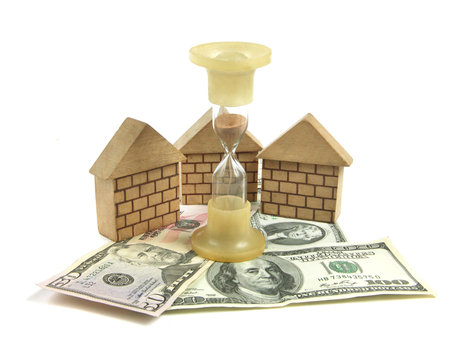 on white background hourglass, the lodges from wooden details in dollar bills