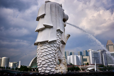 The merlion of Singapore spewing a stream of water.