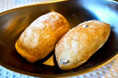 Bread served in a metalic bowl before the main dish.