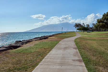A view of a seaside sidewalk at a park in Maui.の写真素材
