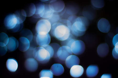 Evening defocused christmas lights boche black background bokehの写真素材