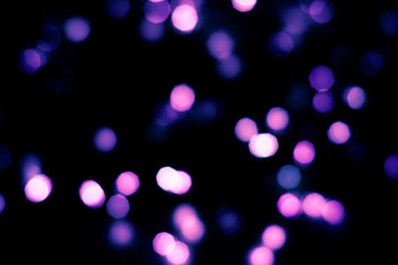 Evening defocused christmas lights boche black background bokehの写真素材