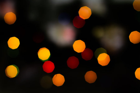 Evening defocused christmas lights boche black background bokeh