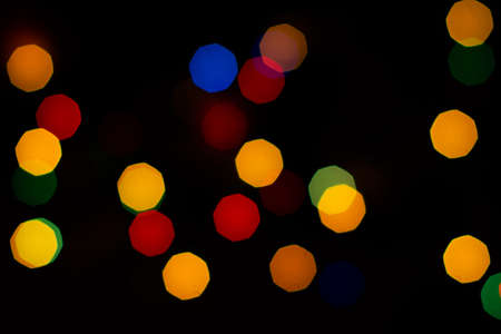 Evening defocused christmas lights boche black background bokehの写真素材