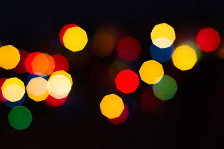 Evening defocused christmas lights boche black background bokehの写真素材