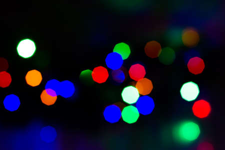 Evening defocused christmas lights boche black background bokehの写真素材