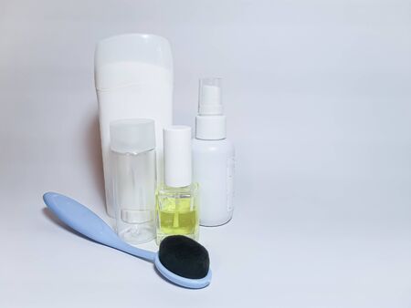 Personal hygiene items - deodorant, cream, brush, lotion on a white background. Space for your text.の写真素材