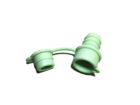 Silicone stopper for a bottle of pale green color. Isolated on a white background.の写真素材