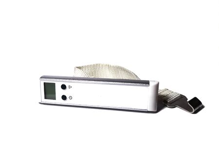 Hand-held electronic luggage scales in white with an electronic displayの写真素材