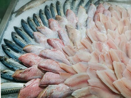 Fresh fish counter at the market. Beautifully laid out on ice mackerel, sea bass and cod fillet. Natural products, proper nutrition, fish diet, local food.の写真素材