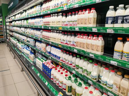 Moscow / Russia - 06.06.2020: a trading rack with pasteurized milk in a large supermarket. Dairy products are one of the most popular product groups.の写真素材