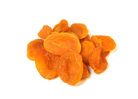 Close-up of dried apricots isolated on a white background. Dried apricots - a dried fruit popular in the east. The concept of healthy nutrition.の写真素材