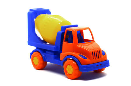 Children's plastic multi-colored toy concrete mixer on a white background. Toy vehicles, outdoor games for children.の写真素材