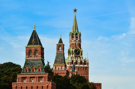 Spasskaya Tower of Moscow Kremlin against background of blue sky. Famous chimes are the main clock of Russia. Sights of Russia, a historical building, symbol of the country.の写真素材