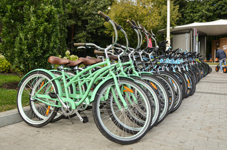 Bicycle rental point in the city park. Parking lots of bicycles. Moscow / Russia - 09.20.2020
