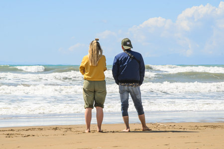 Manavgat, Turkey, 03 17 2021 - Couple of young people, a girl and a guy, stand and look at the...