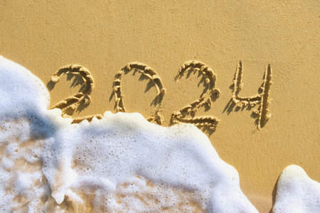 Sea wave with foam washes away the inscription 2024. Handwritten inscription 2024 on beautiful...
