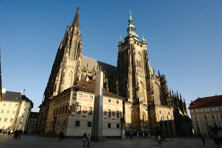 Stunning view of St. Vitus Cathedral in Prague under clear blue sky during middayの写真素材