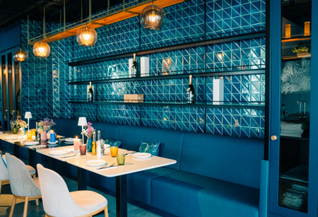 Elegant modern dining area with blue accents and stylish decor for a memorable dining experienceの写真素材