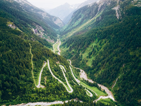 Aerial view of a winding road in the Alps. View from above.