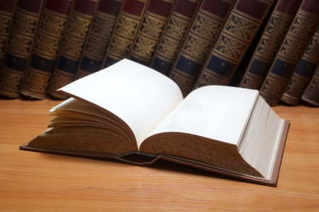 Stack of Old books on wooden backgroundの写真素材