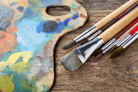 Brushes and colorful almost abstract palletの写真素材