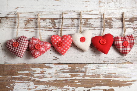 Fabric hearts on a wooden backgroundの写真素材