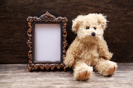 Vintage toys woth frame for photo on wooden backgroundの写真素材